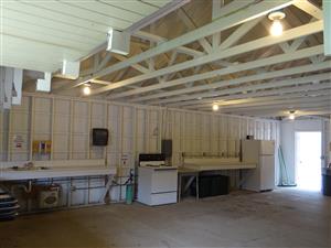 Building 2 - Large Kitchen Facility - internal view showing kitchen area (sink, stove, countertop, refrigerator)