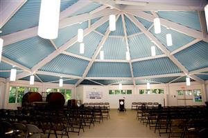 Carousel - round room with chairs set up for a presentation, blue ceiling