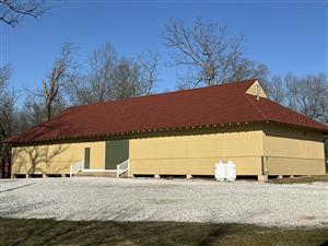 Dance Hall - rectangular building with green entry doors